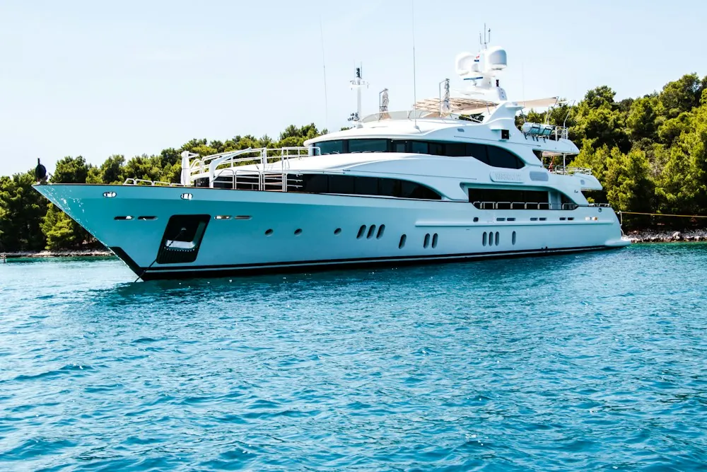 Private motor yacht moored on blue coastal water
